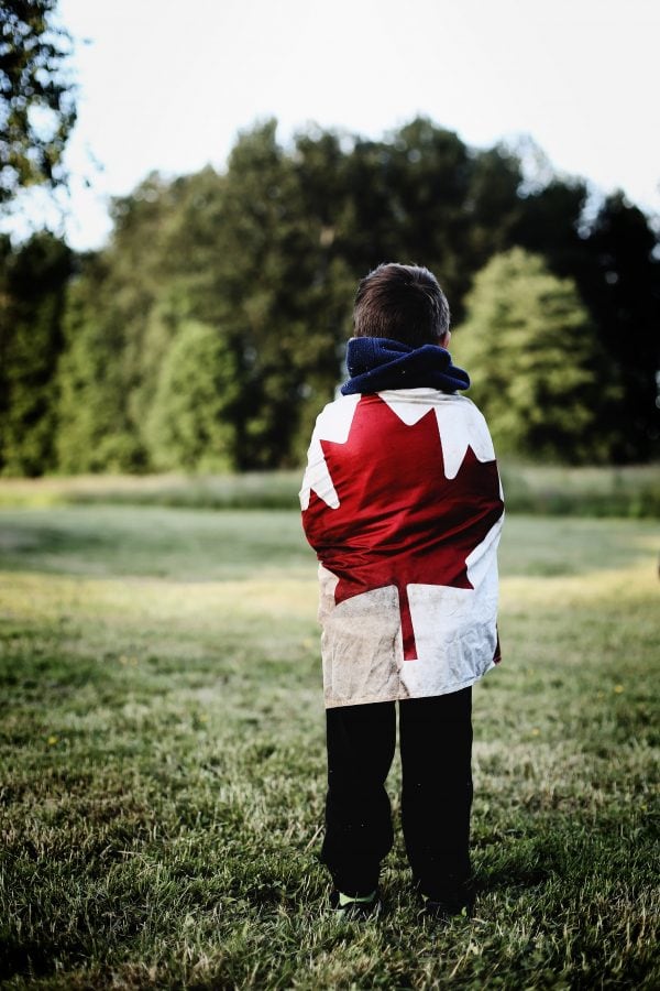 French Canadian voice actors - child wrapped in canadian flag