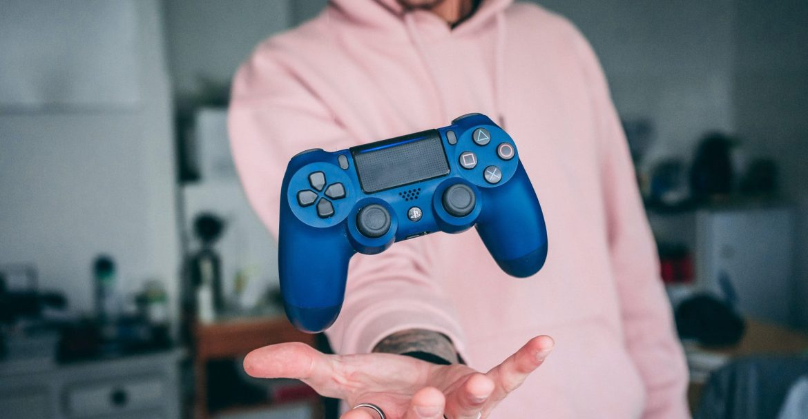 Video Game Voice Overs: How to Hire Video Game Voice Actors - Gamer catches ps4 controller