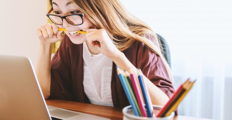 How to Improve Learning Retention Using Voiceover - female student chewing pencil