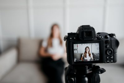 Explainer Videos Why Hire a Pro Voice Actor - Young woman sits in front of camera