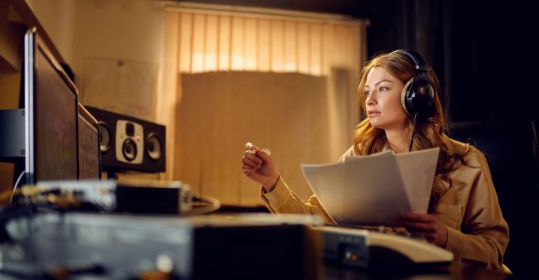 6 Tips for Directing Voiceover Talent - Female audio producer in recording studio