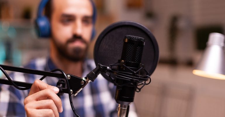 How to Submit Your Podcast to Apple, Google, or Spotify — content creator recording podcast