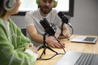 The Incredible Evolution of Podcasts — Two People Recording a Podcast