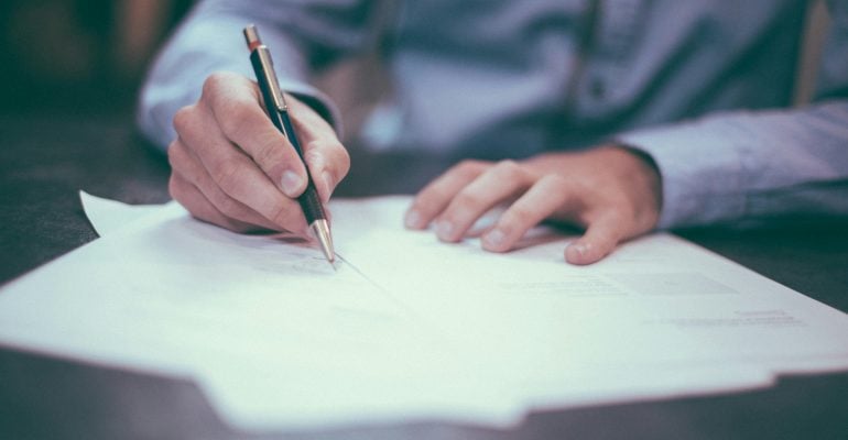 Voice Over Contract Essentials - Man signing contract